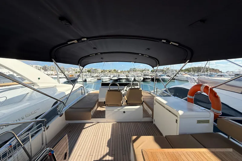 Marckeric Yacht Photos Pics Luxurious 2012 Fairline Squadron 58 yacht interior with seating and marina view.