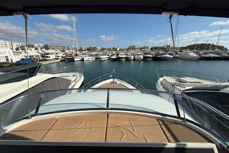 Marckeric Yacht Photos Pics View from 2012 Fairline Squadron 58 yacht overlooking marina with multiple boats docked.