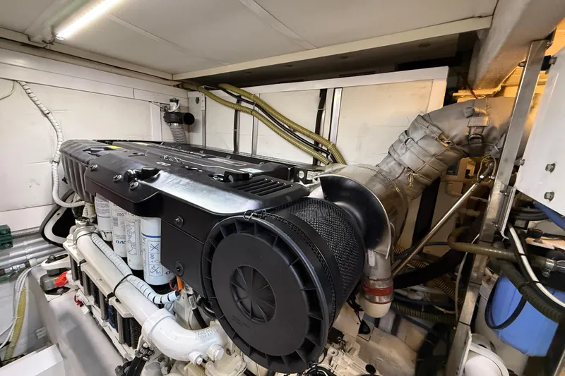 Marckeric Yacht Photos Pics Engine room of 2012 Fairline Squadron 58 yacht, showcasing detailed machinery and components.