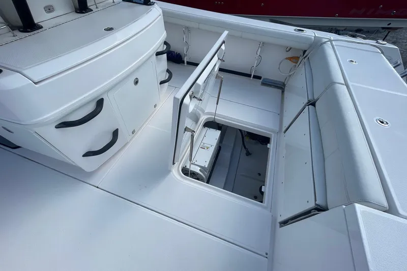  Yacht Photos Pics 2022 Everglades 335 Center Console boat interior with open storage compartment.