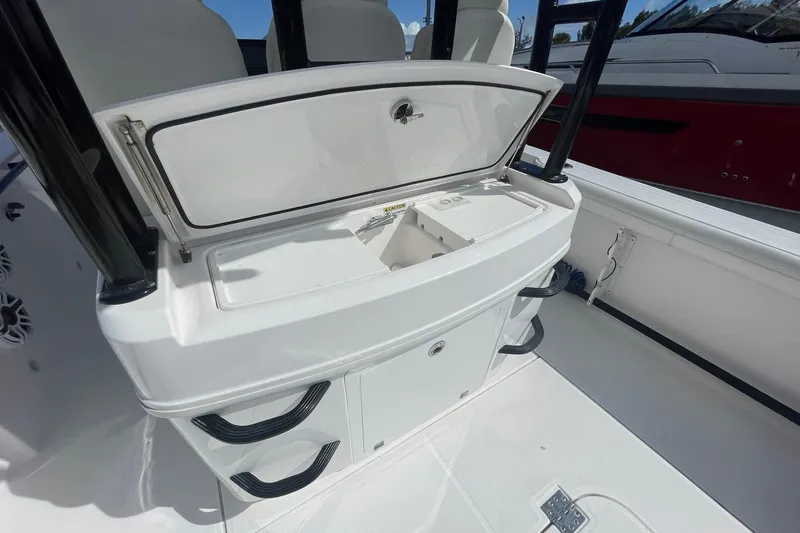  Yacht Photos Pics 2022 Everglades 335 Center Console boat interior with open storage compartment.