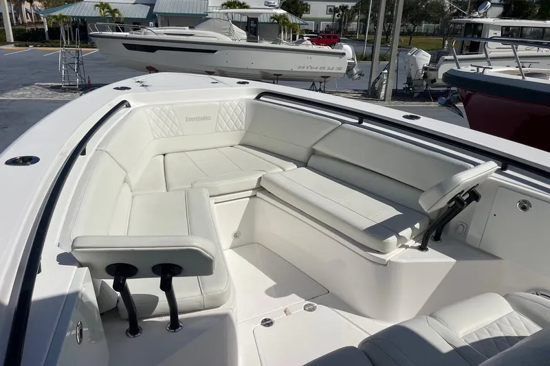  Yacht Photos Pics 2022 Everglades 335 Center Console boat with spacious white seating area.