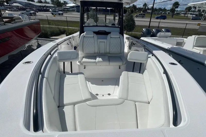  Yacht Photos Pics 2022 Everglades 335 Center Console boat with spacious white seating area.