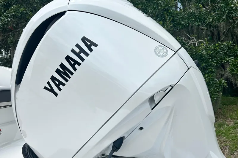  Yacht Photos Pics 2024 Cobalt R6 with Yamaha outboard motor, white finish, outdoor setting.