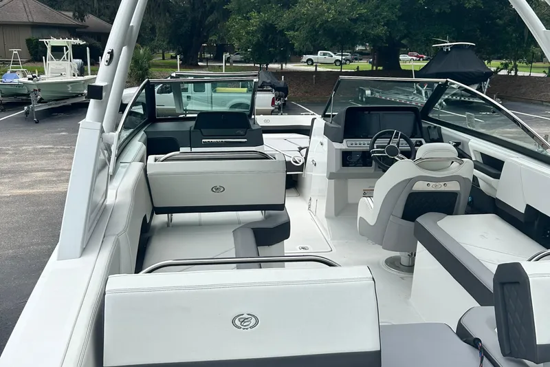  Yacht Photos Pics 2024 Cobalt R6 boat interior with modern seating and steering console.