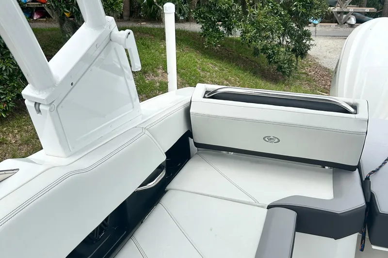  Yacht Photos Pics 2024 Cobalt R6 boat interior with white and gray seating, outdoor setting.