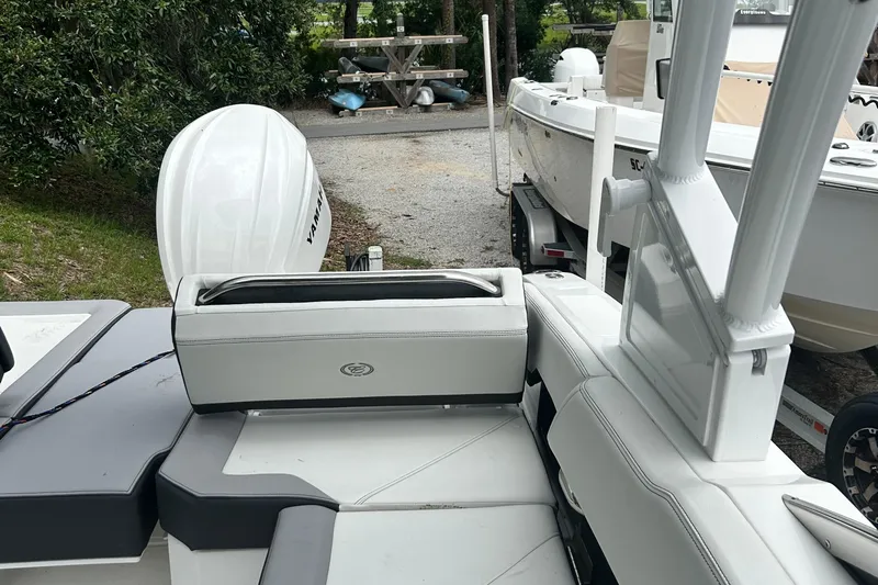  Yacht Photos Pics 2024 Cobalt R6 boat interior with Yamaha engine, parked near other boats.