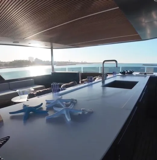  Yacht Photos Pics Luxury yacht Inace AVENTURA 106, 2027 model, featuring a sleek outdoor bar with ocean view.