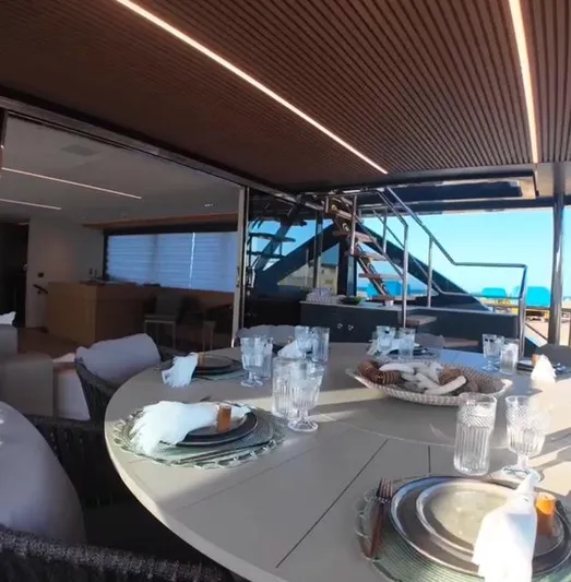  Yacht Photos Pics Luxurious dining area on the 2027 Inace AVENTURA 106 yacht, featuring elegant table settings.