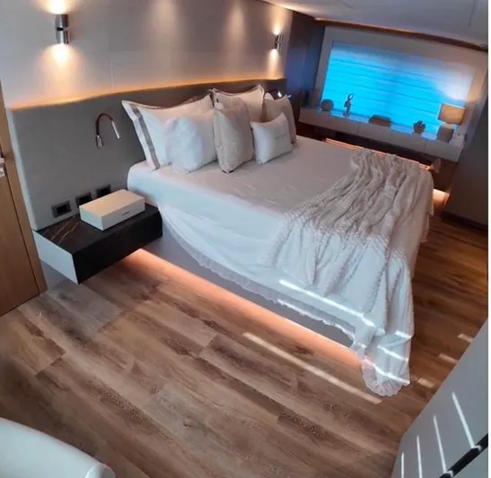  Yacht Photos Pics Luxurious bedroom interior on Inace AVENTURA 106 yacht, 2027 model, featuring modern design and ambient lighting.