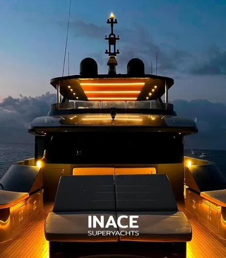  Yacht Photos Pics Inace Aventura 106 superyacht illuminated at dusk, showcasing luxury design, 2027 model.