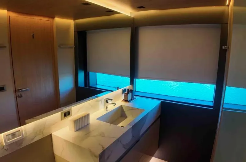  Yacht Photos Pics Luxurious bathroom interior on Inace AVENTURA 106 yacht, featuring modern design and ocean view.