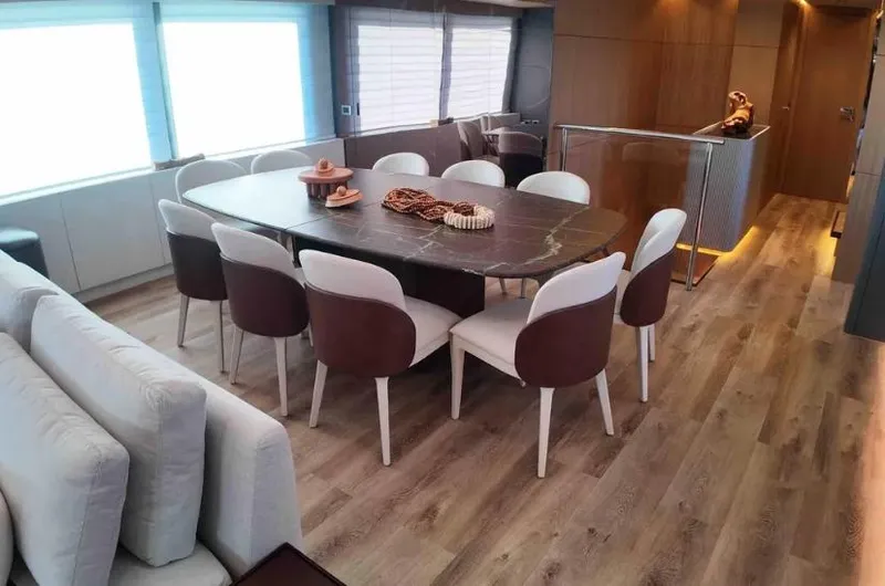  Yacht Photos Pics Luxurious dining area on 2027 Inace AVENTURA 106 yacht with elegant decor and modern furnishings.