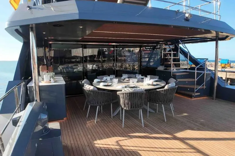  Yacht Photos Pics Luxurious 2027 Inace AVENTURA 106 yacht deck with elegant dining setup.