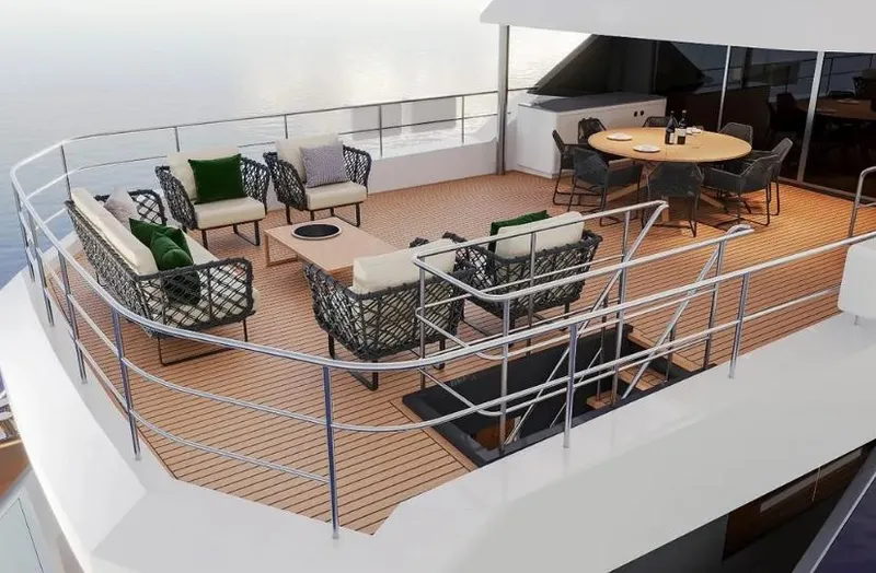  Yacht Photos Pics Luxurious deck of 2027 Inace AVENTURA 106 yacht with elegant seating and dining area.