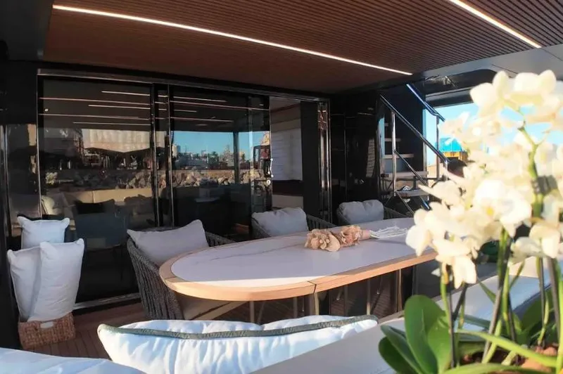  Yacht Photos Pics Luxurious 2027 Inace AVENTURA 106 yacht interior with elegant dining area and floral decor.
