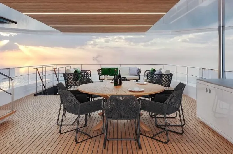  Yacht Photos Pics Luxurious deck of 2027 Inace AVENTURA 106 yacht with elegant seating and ocean view.