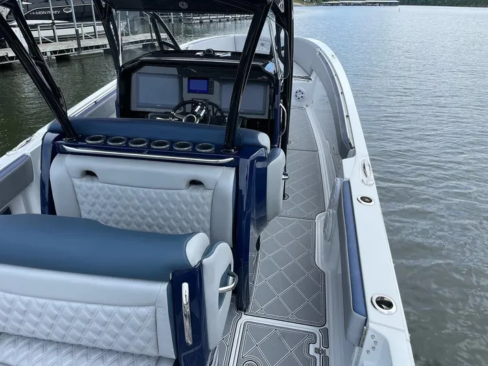 Yacht Photos Pics 2019 Nor-Tech 390 Sport Center Console boat interior with luxurious seating and modern dashboard.
