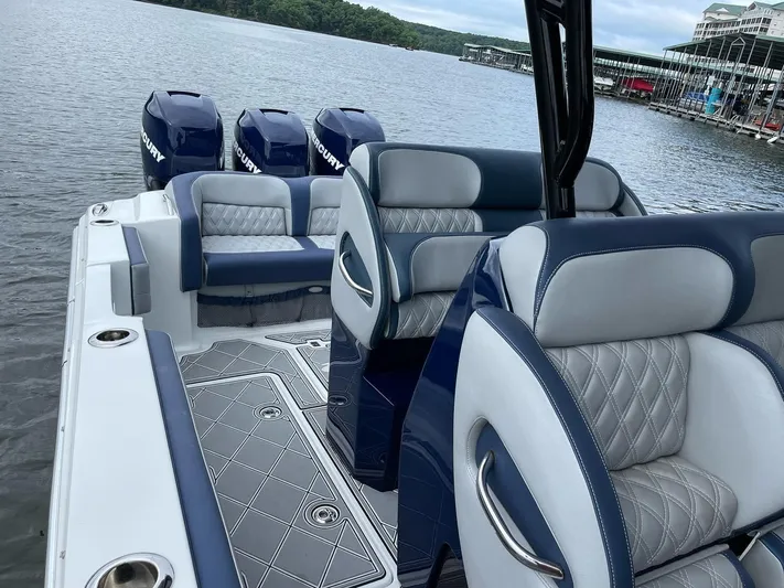  Yacht Photos Pics 2019 Nor-Tech 390 Sport Center Console boat with luxurious seating and Mercury engines on a lake.
