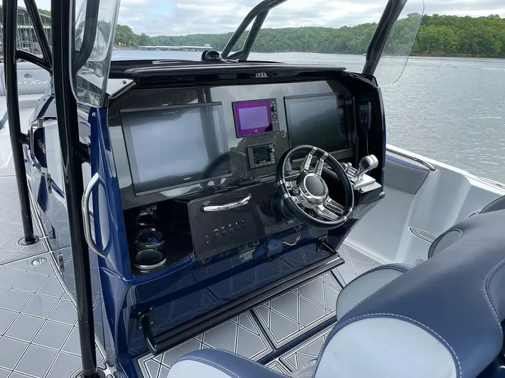  Yacht Photos Pics 2019 Nor-Tech 390 Sport Center Console dashboard with modern navigation screens and steering wheel.