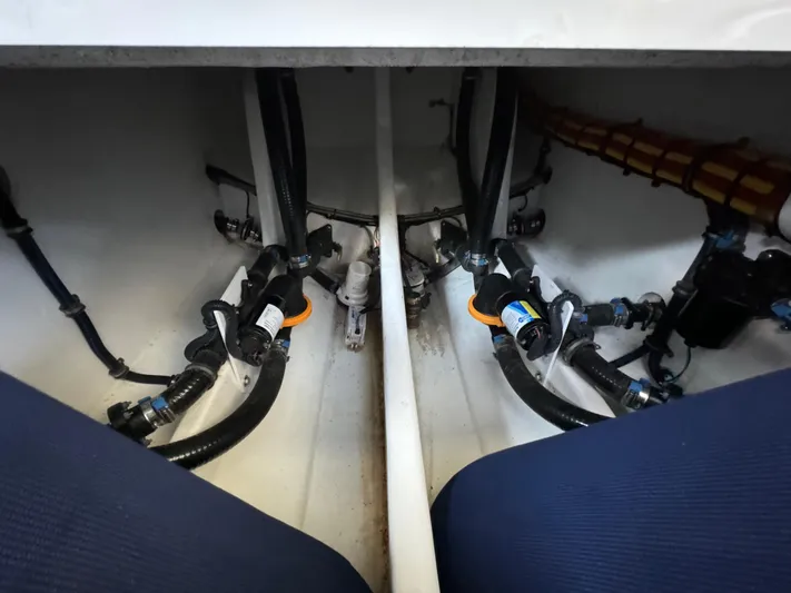  Yacht Photos Pics 2019 Nor-Tech 390 Sport Center Console bilge area with hoses and fittings.