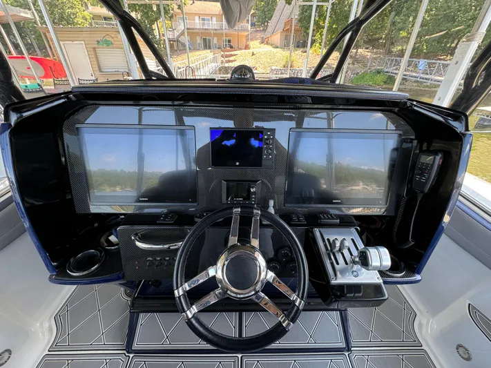  Yacht Photos Pics 2019 Nor-Tech 390 Sport Center Console dashboard with advanced navigation and control systems.