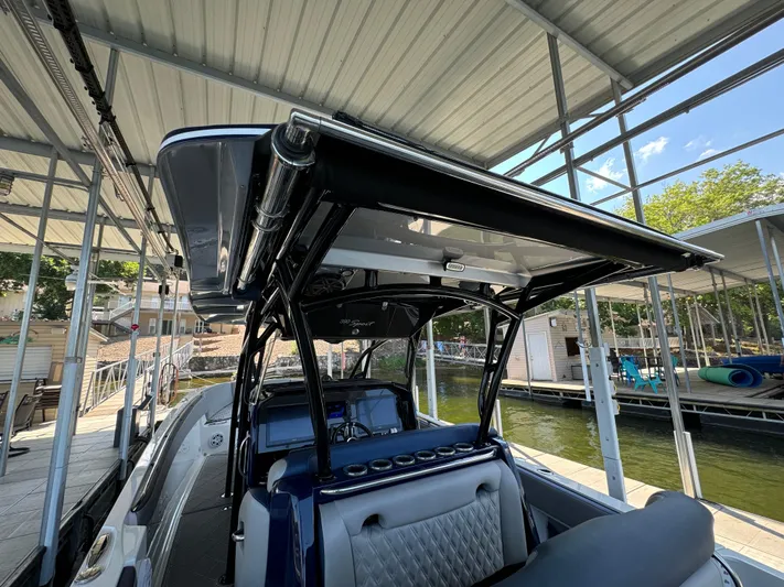  Yacht Photos Pics 2019 Nor-Tech 390 Sport Center Console boat docked under a covered marina.