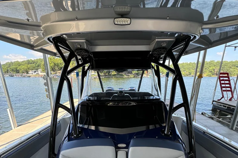  Yacht Photos Pics 2019 Nor-Tech 390 Sport Center Console boat docked by a scenic lake.