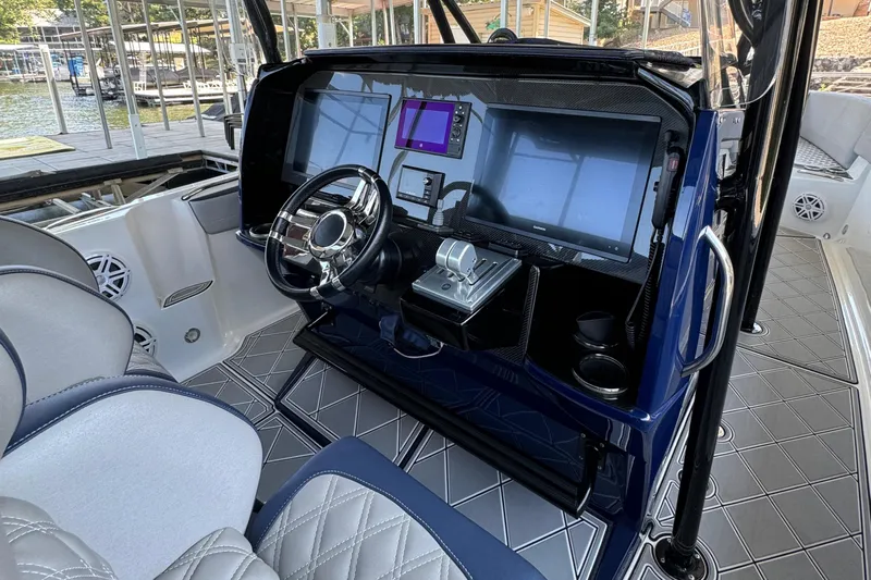  Yacht Photos Pics 2019 Nor-Tech 390 Sport Center Console helm with advanced navigation displays and controls.
