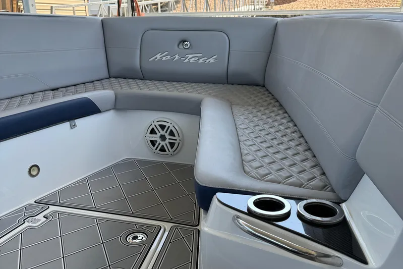  Yacht Photos Pics 2019 Nor-Tech 390 Sport Center Console interior with quilted seating and cup holders.