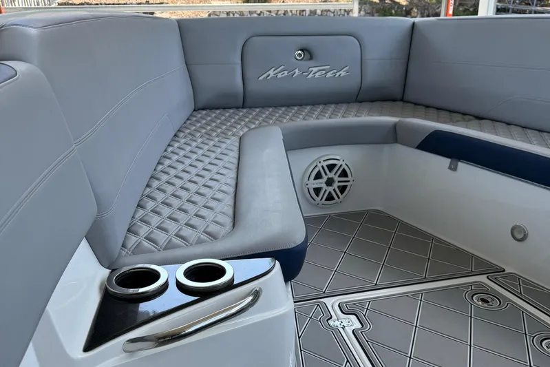  Yacht Photos Pics 2019 Nor-Tech 390 Sport Center Console interior with gray seating and cup holders.