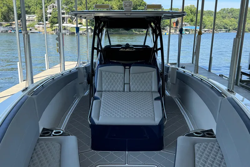  Yacht Photos Pics 2019 Nor-Tech 390 Sport Center Console boat interior with luxurious seating and lake view.