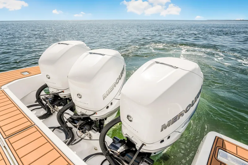 Equanimity Yacht Photos Pics Triple Mercury outboard engines on 2023 Jeanneau DB43 boat, cruising on open water.