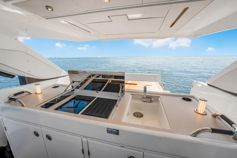 Equanimity Yacht Photos Pics Outdoor kitchen on 2023 Jeanneau DB43 yacht with ocean view.
