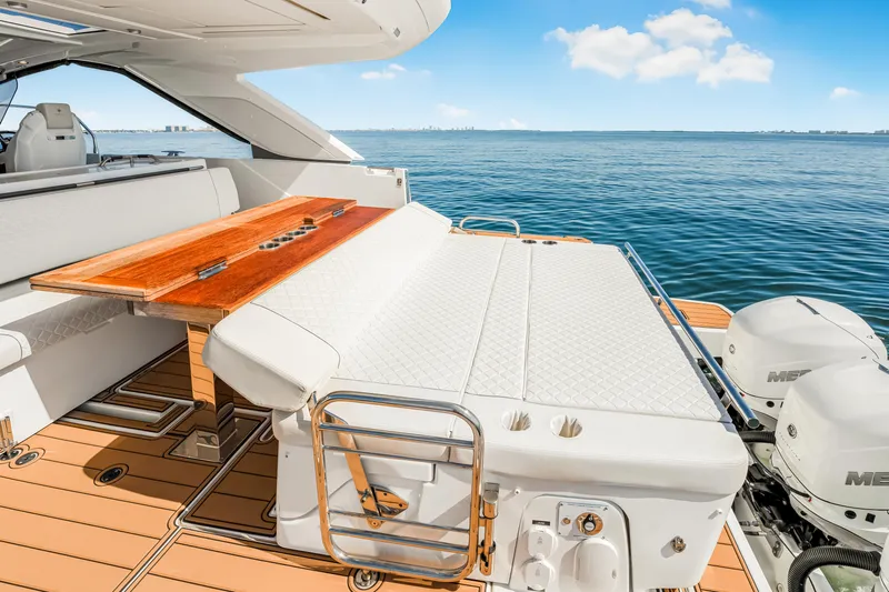 Equanimity Yacht Photos Pics 2023 Jeanneau DB43 yacht with luxurious deck seating and ocean view.