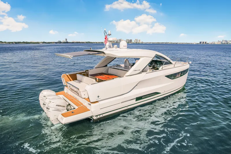 Equanimity Yacht Photos Pics 2023 Jeanneau DB43 yacht cruising on open water under a clear blue sky.