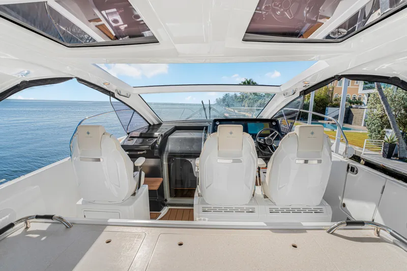 Equanimity Yacht Photos Pics 2023 Jeanneau DB43 boat interior with modern helm and ocean view.