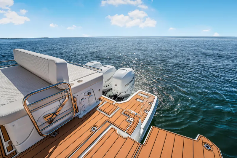 Equanimity Yacht Photos Pics 2023 Jeanneau DB43 boat with outboard motors on open water.