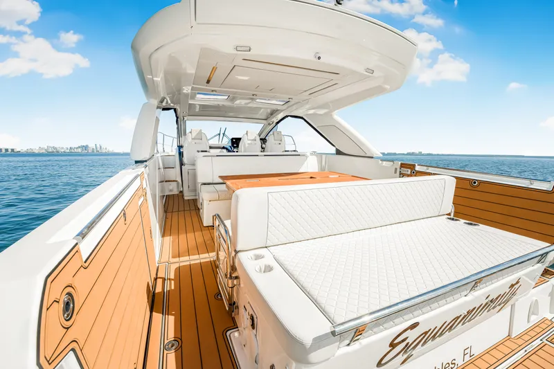 Equanimity Yacht Photos Pics 2023 Jeanneau DB43 yacht with spacious deck and luxurious seating on open water.