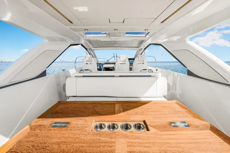 Equanimity Yacht Photos Pics 2023 Jeanneau DB43 yacht interior with sleek design and wooden flooring, overlooking the ocean.