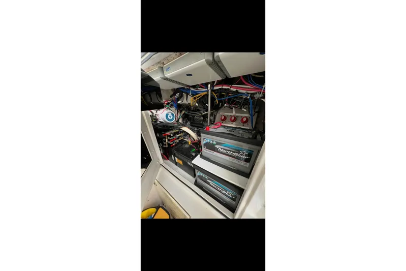  Yacht Photos Pics Electrical system of a 2003 Jupiter 31 boat with NorthStar batteries and wiring.