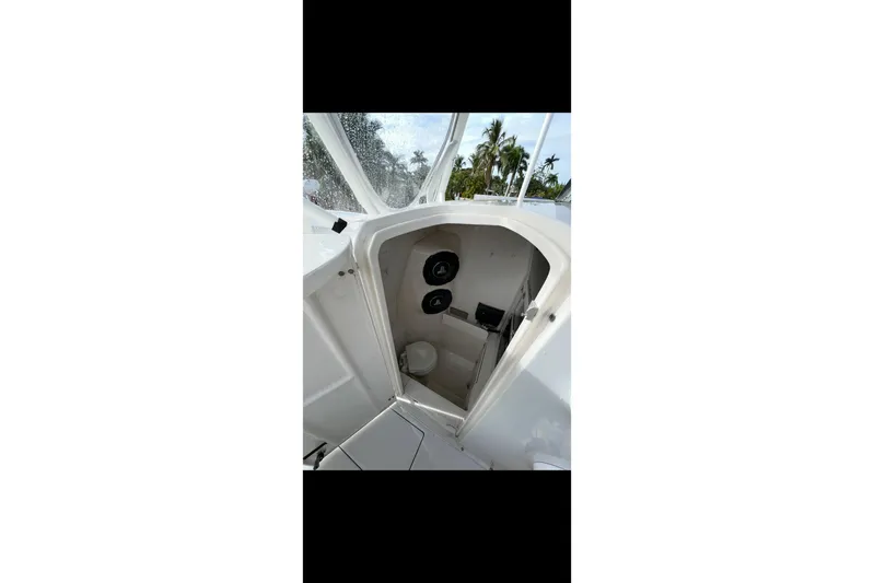  Yacht Photos Pics 2003 Jupiter 31 boat interior cabin with white finish and visible controls.