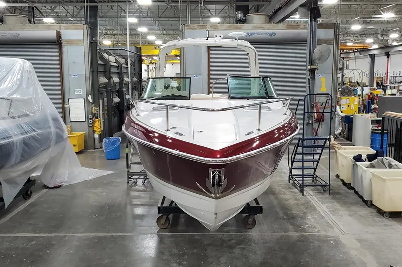  Yacht Photos Pics 2012 Formula 310 Sun Sport boat in a workshop setting.