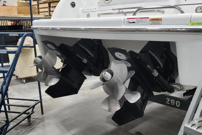  Yacht Photos Pics 2012 Formula 310 Sun Sport boat with dual propellers in a workshop setting.