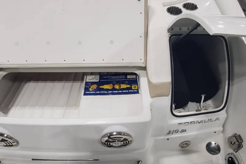  Yacht Photos Pics 2012 Formula 310 Sun Sport boat interior with storage compartment and speakers.