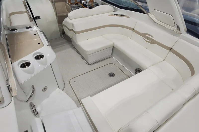  Yacht Photos Pics Luxurious interior of 2012 Formula 310 Sun Sport boat with plush seating and sleek design.