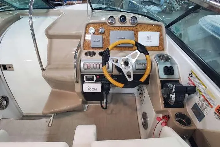  Yacht Photos Pics 2012 Formula 310 Sun Sport boat dashboard with steering wheel and navigation controls.