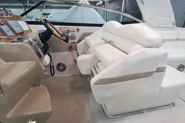  Yacht Photos Pics 2012 Formula 310 Sun Sport boat interior with white seating and modern dashboard.