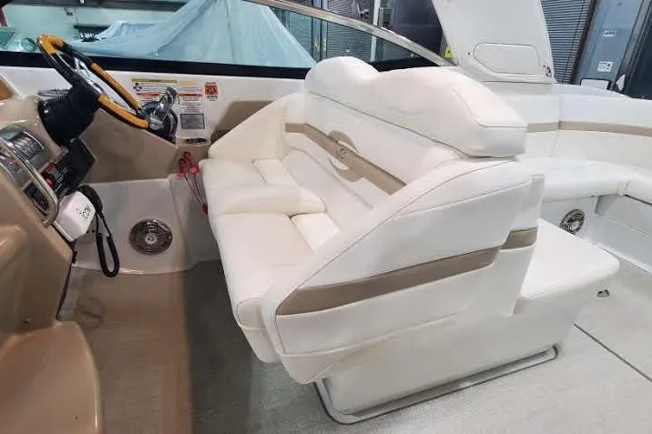  Yacht Photos Pics Luxurious interior of a 2012 Formula 310 Sun Sport boat with plush white seating.