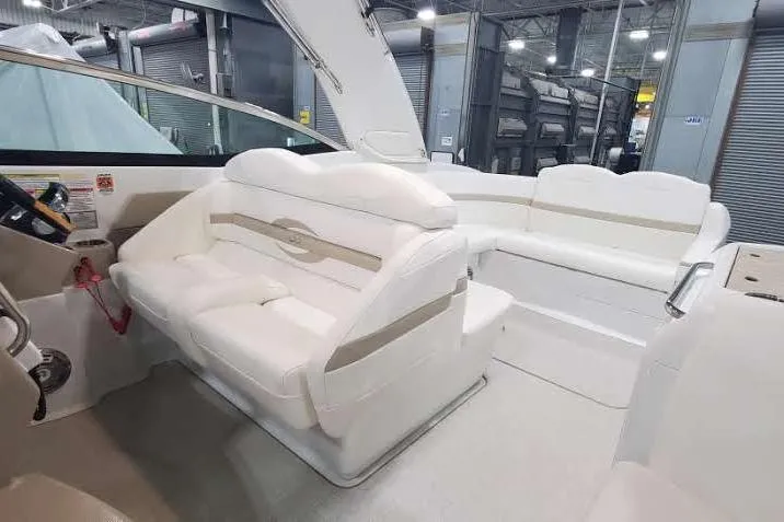  Yacht Photos Pics 2012 Formula 310 Sun Sport boat interior with white seating in a showroom.